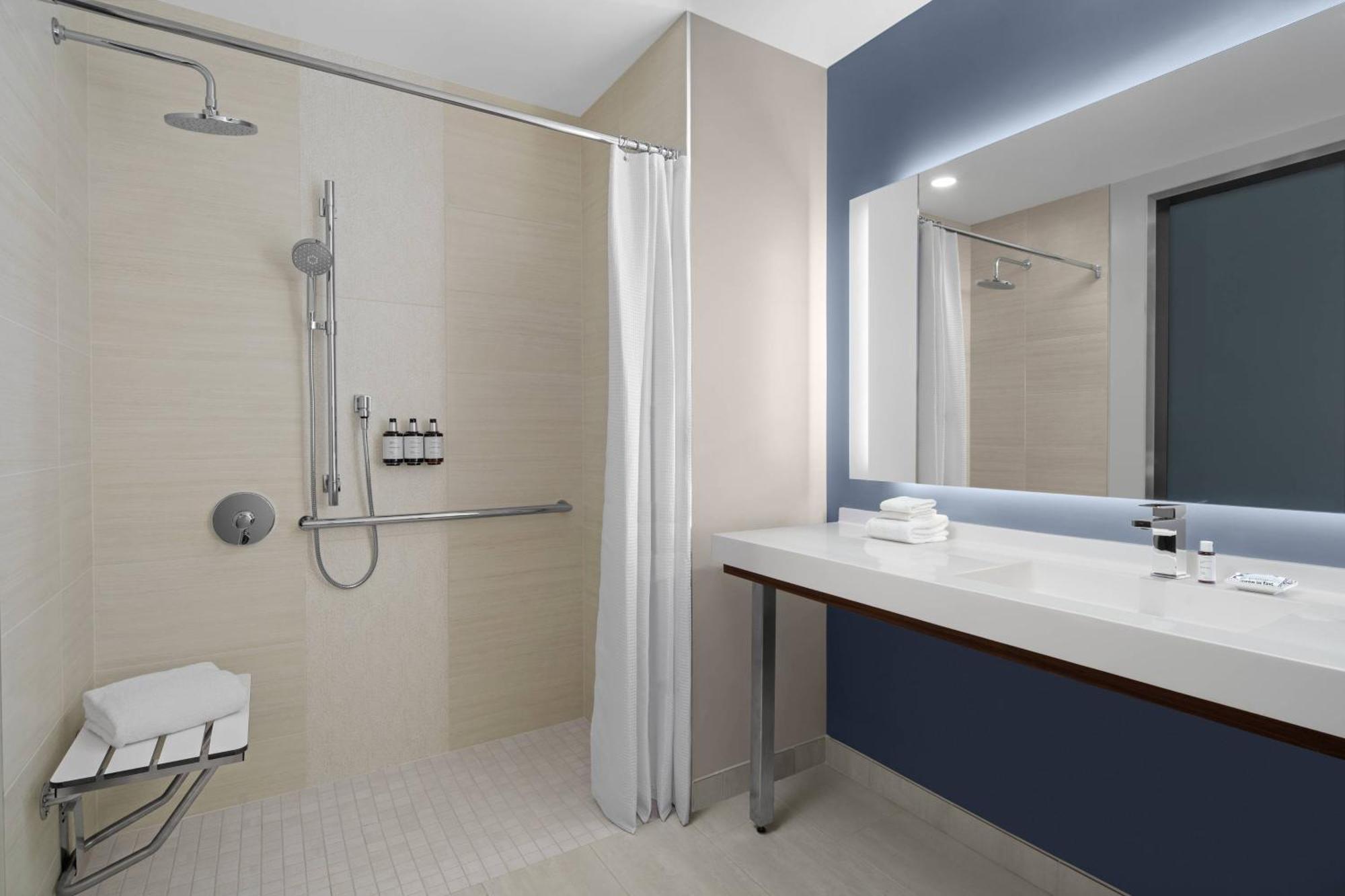 Corner King Suite with Sofa Bed, Roll-In Shower, Balcony and Ocean View - Mobility and Hearing Accessible